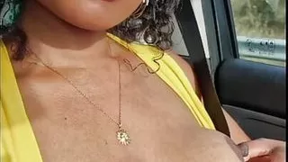 Beautiful ebony shows her in the car.