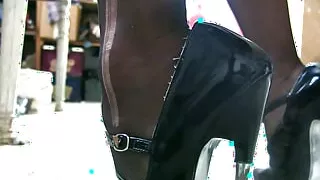 Stiletto high heels scretching on the dusty  floor