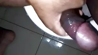Horny hunk punish his oiled up black dick in bathroom until cum.
