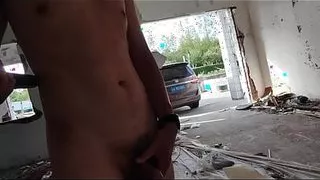 Naked wandering around a broken house on the side of a busy road and masturbating