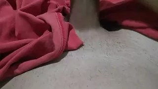 Naked young man masturbating big thick cock under the blanket