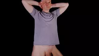 Man strips naked as he masturbates his uncut shaved cock becomes hard and horny