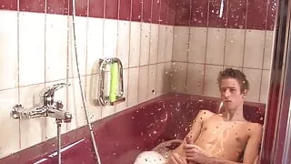 Sexy gay boys in bathtub enjoy squirting cum