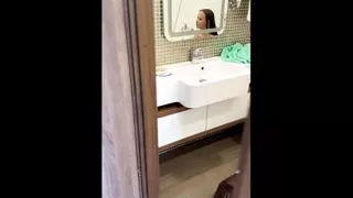 Juicy Julia  peeing in bathroom and showing her big tits