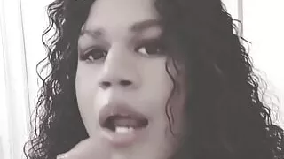Ebony trans sucking her new dildo