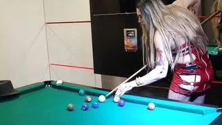 Holly smoking and playing pool