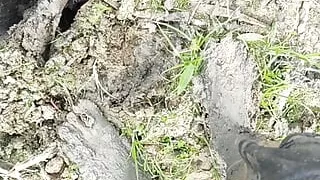 Wading into Lakebed of Mud Barefoot and Wallowing