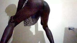 Huge cock shemale trying on some lingerie with a hard on.