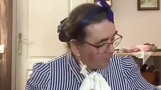 In an outfit with a blue petticoat to suck a dildo