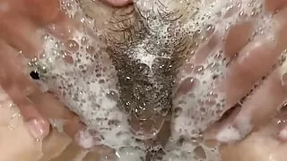 Hairy MILF gets it in the bathtub, beautiful wet clit