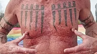 Playing with my nipples at the beach