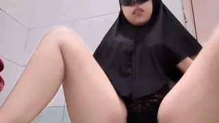 Asian woman has fun in the shower while playing with her breasts