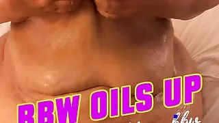 Fat belly BBW oils up her big saggy tits and belly folds