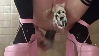 Sissy fucking her ass with a big black dildo, fresh cream and an anal expander