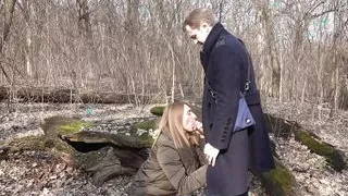 In the forest, a girl got on her knees and start sucking cock