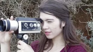 Lovely hairy brunette babe masturbates at the seashore