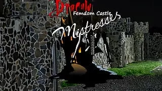 Extinguishing the cigarette on the prisoners balls - Mistress Zeida and Mistress Alexandra