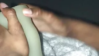Stroking big black cock with green sex toy