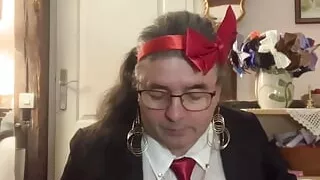 In outfit with a gray evening skirt to suck a dildo