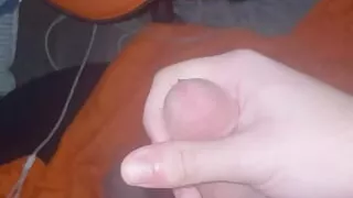 Boy trying to be quiet while having fun in his room