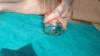 Fucking my oiled up pussy with bottles and stretching