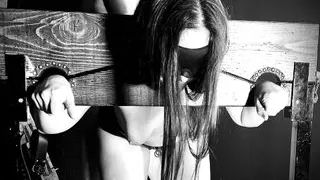 Topless Blindfolded Brunette Sex slave in stocks sucks cock and gets fucked