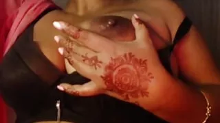 She shows her boobs in her bra and sucks nipples.