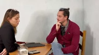 manager on desk with colleague who wants to get promoted and skip company dinner