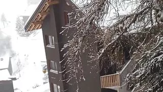 On the Balcony with Snow