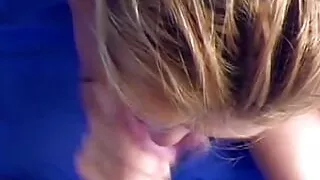 A sexy blonde gives a deep blowjob to his small white cock