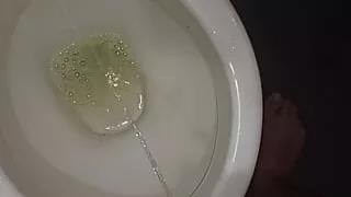 Peeing in the toilet with catheter in penis