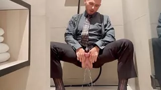 He is dressed like a gentleman in suit and tie but act like a bitch and piss like a girl with his male-pussy