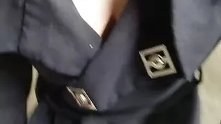 Beautiful girl with big trying on a dress walks from the store booth to her car in the parking lot without lingerie.