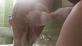 Couple take a bath and he touch her busty body