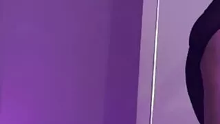 stretching with pylon in bodysuit