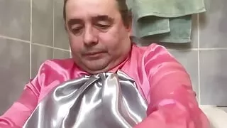 In bourgeois attire to take a piss shower with bottles