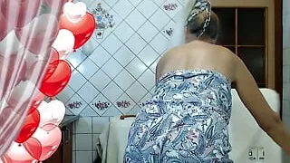 Hot housewife Lukerya puts on black lingerie in the kitchen