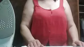 Stepmom, 57 years old, with Big Natural Tits, irons clothes and has a secret video call with her Stepson.
