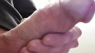 Big camera zoom on the dick releasing the precum.