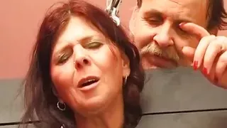 Chubby German slut sprayed with wax in BDSM scene