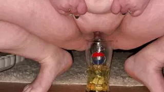 Chubby mom masturbates and pees in the glass