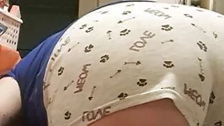 in the kitchen peeling potatoes and my husband looks at my shorts