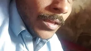 Handsome man showing his  face to his fan's.