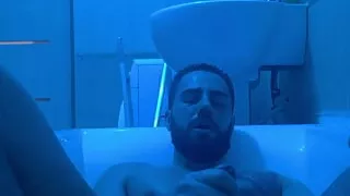 Bearded man jerking off in the bathroom