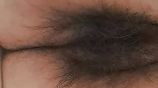 Mature milf's fat, open, hairy pussy seen from below