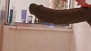 Mature milf backing up on a bbc dildo while in the shower