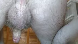 Oiled up and completely naked. Not even socks. Showing you everything and masturbating.