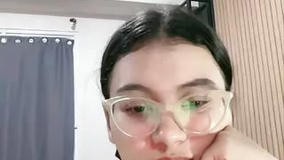 Sexy stylish glasses chick on camera