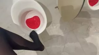 Black pantyhose encasement in public WC