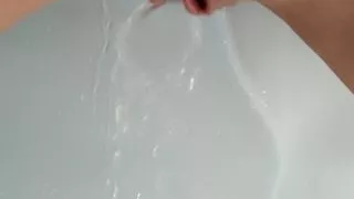 The little slut licks her piss and her wetness